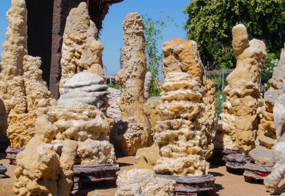 Stone sculptures under clear blue sky