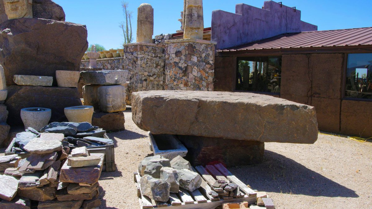 Stone slabs and pottery in outdoor setting