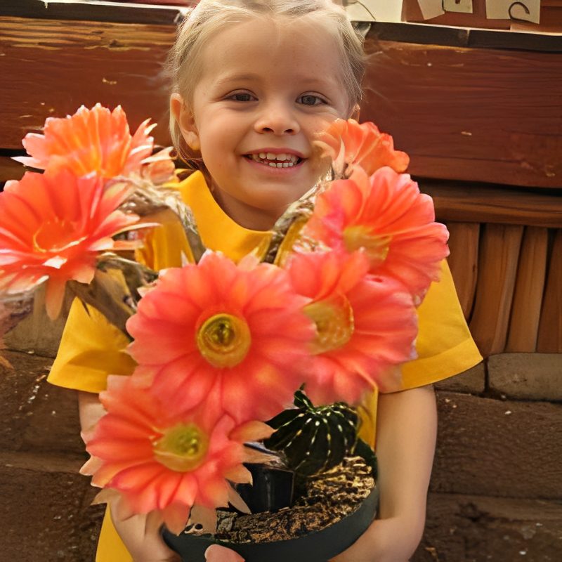 Smiling girl with colorful flower bouquet