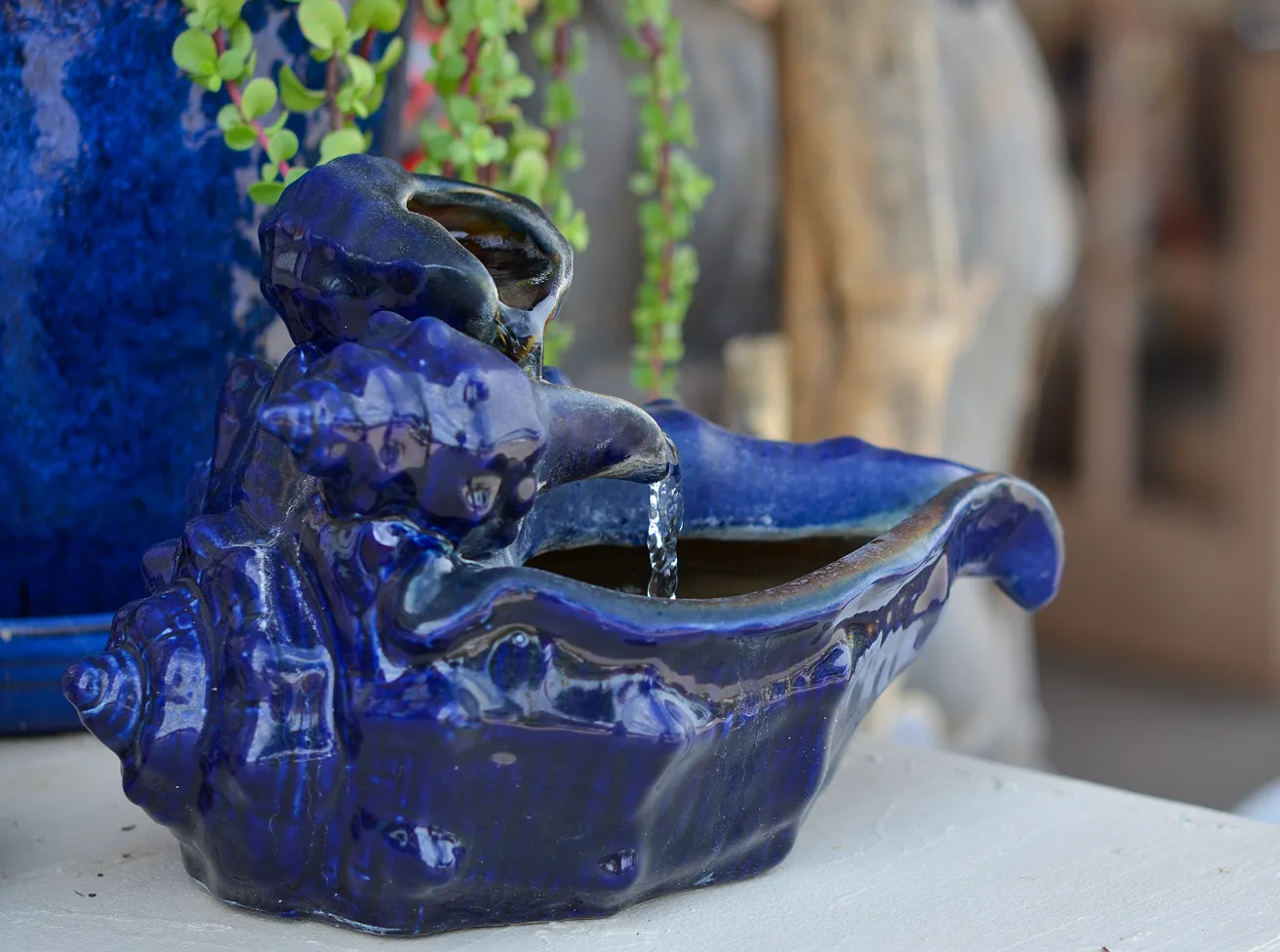 Decorative blue seashell-shaped water fountain