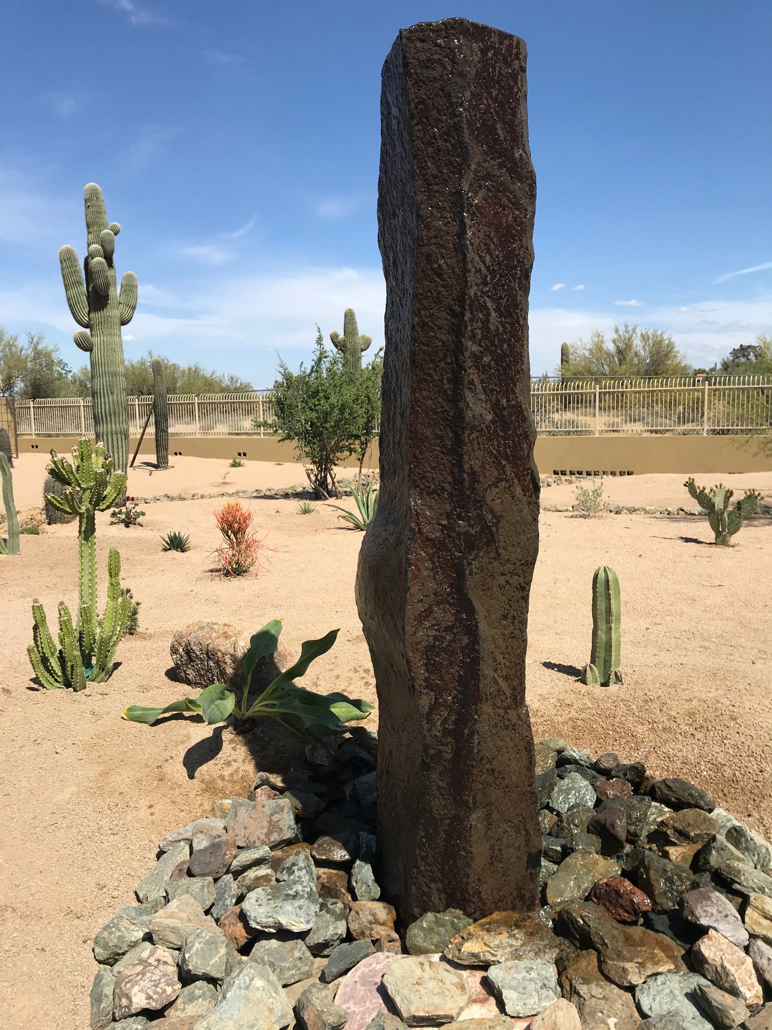 Basalt column fountain installed in a backyard